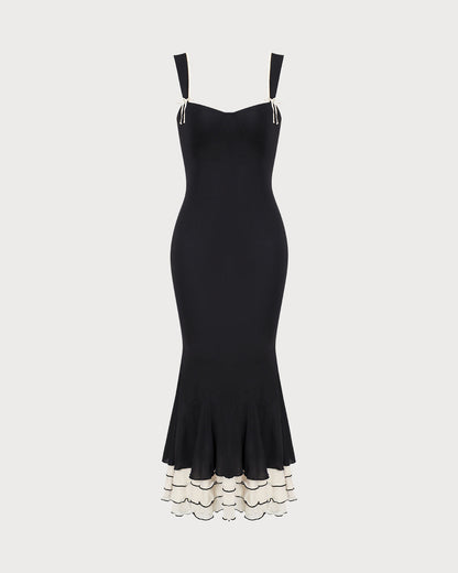 La robe longue fourreau noire à encolure cœur