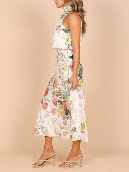Robe longue fleurie à encolure dos-nu et taille élastiquée